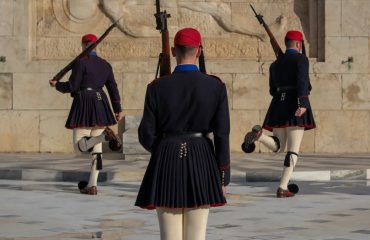 Evzones ceremonial guards in traditional attire during the changing of the guard in Athens.